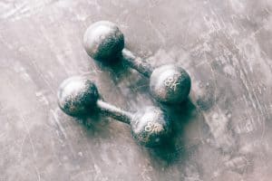 Two eight kilo dumbells on the floor